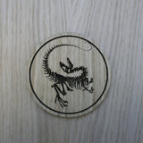 Laser cut wooden coaster personalised. Raptor Dinosaur Skeleton Fossil