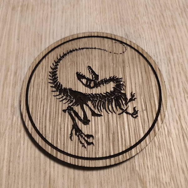 Laser cut wooden coaster personalised. Raptor Dinosaur Skeleton Fossil
